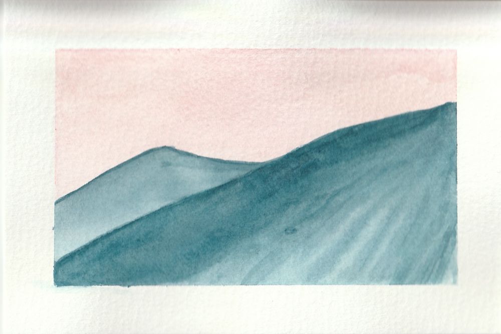 A 4x6 watercolor painting of a pink sky with a blue and white volcano slope in the foreground and a summit in the background. It has a thick white border.
