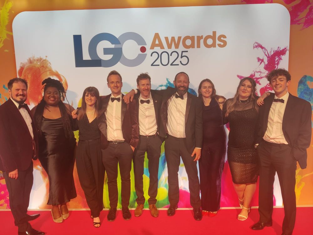 Southwark Council 'Securing the Future of Council Housing' campaign team stood on the LGC Awards stage. 