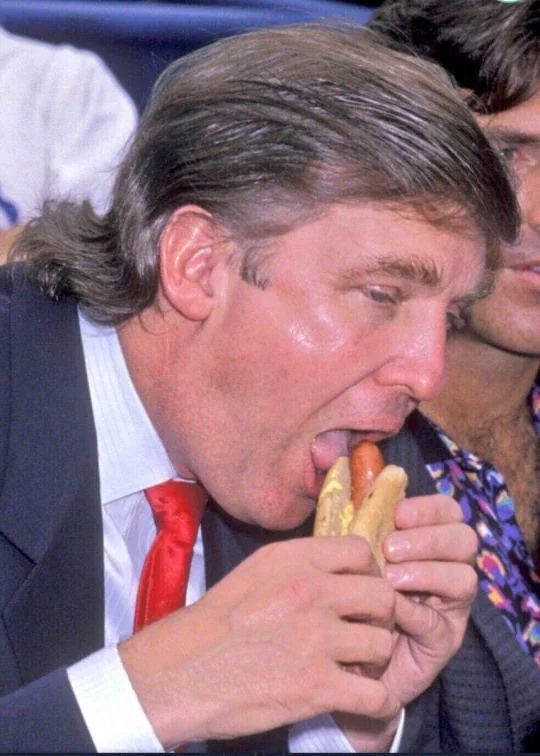 Our big beautiful president eating a big beautiful hot dog