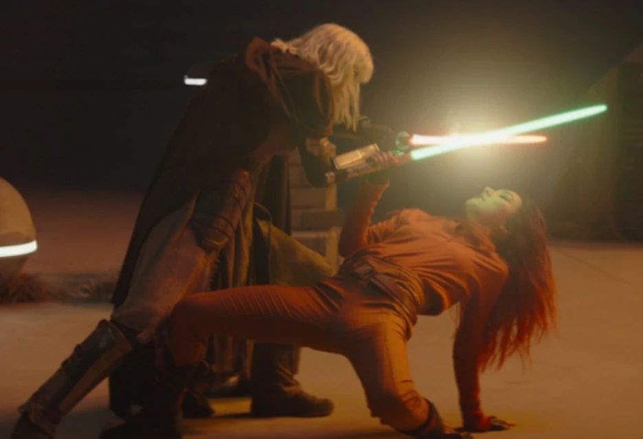 Sabine Wren and Shin Hati dueling with locked lightsabers.