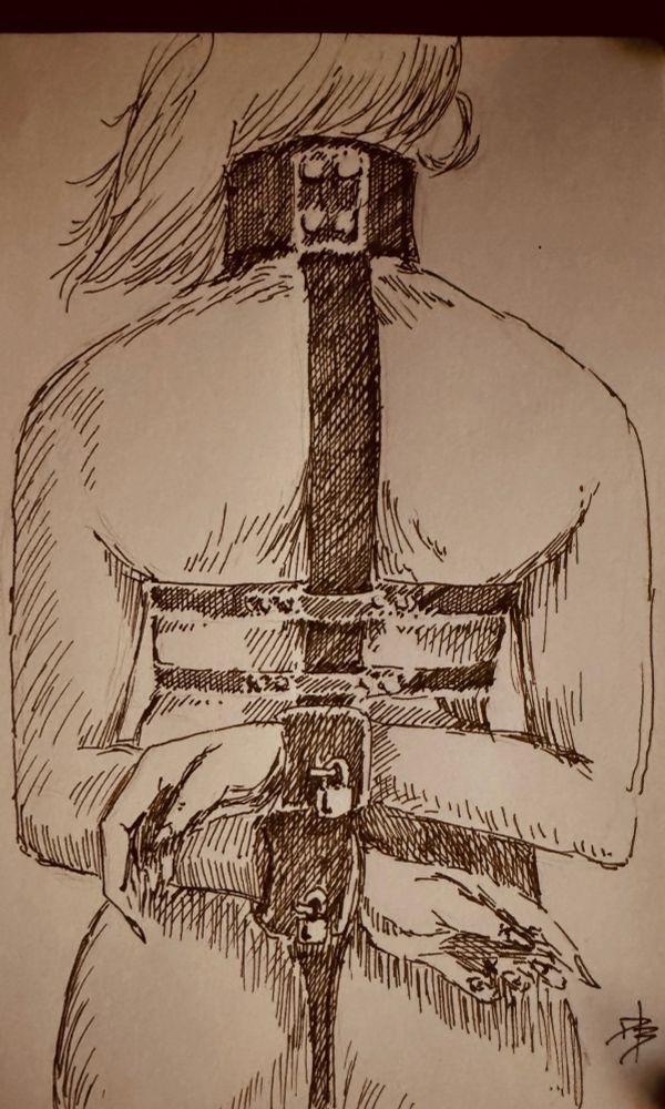 A woman in strict leather bondage. NSFW!