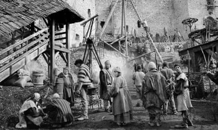 A grim, medieval looking town in black and white. From HARD TO BE A GOD.