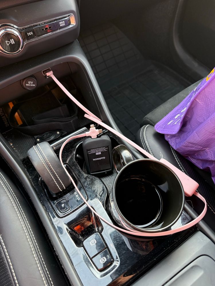 Ceramic mug of coffee in the car cup holder. Charging my bike computer en route. Heart rate strap I had to go back for per usual. 