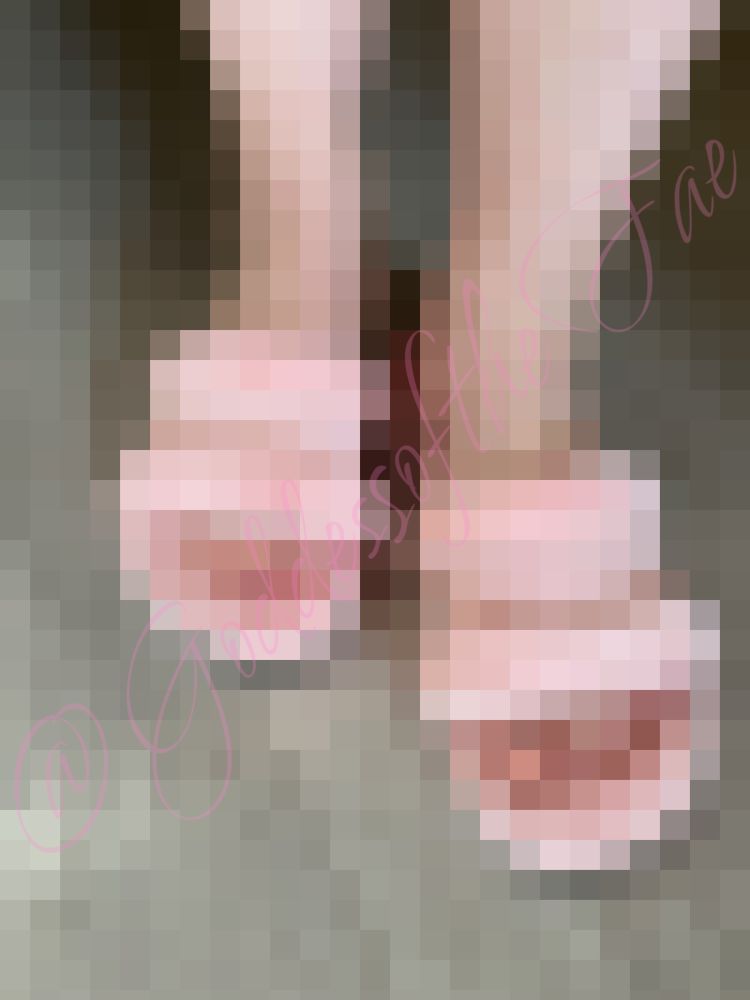 Pixelated picture of feet in pink fluffy slippers 