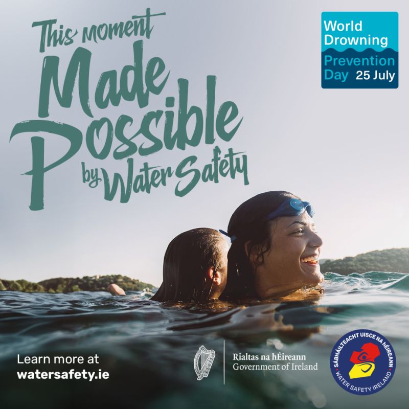 water safety poster showing a parent and child smiling in the water, with the slogan this moment made possible by water safety