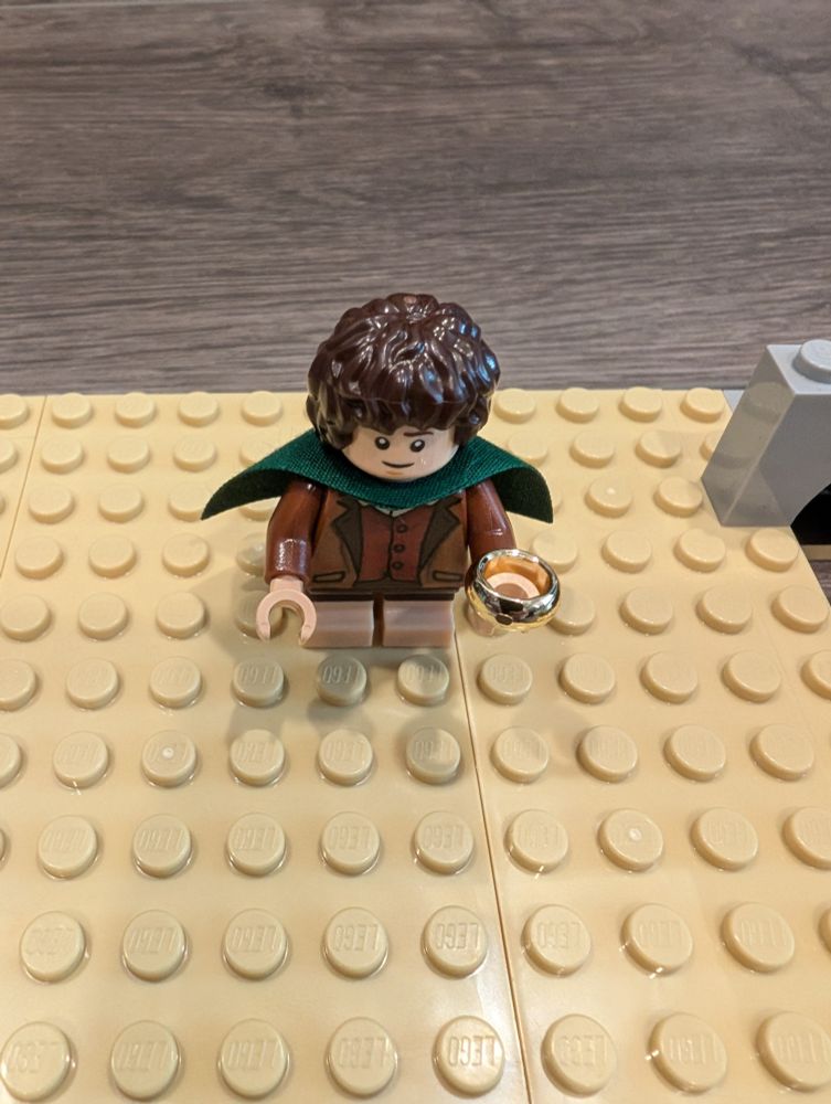 Lego mini figure of Frodo with small ring