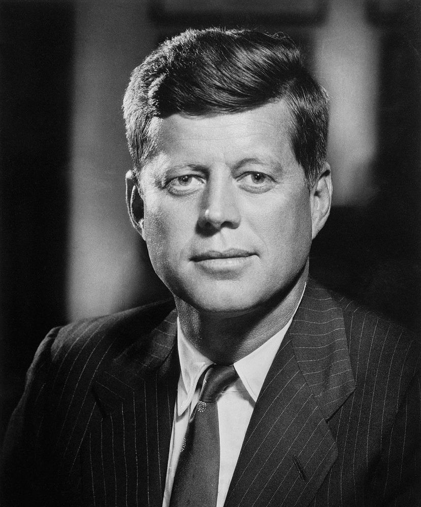 President John F. Kennedy in a suit and tie.