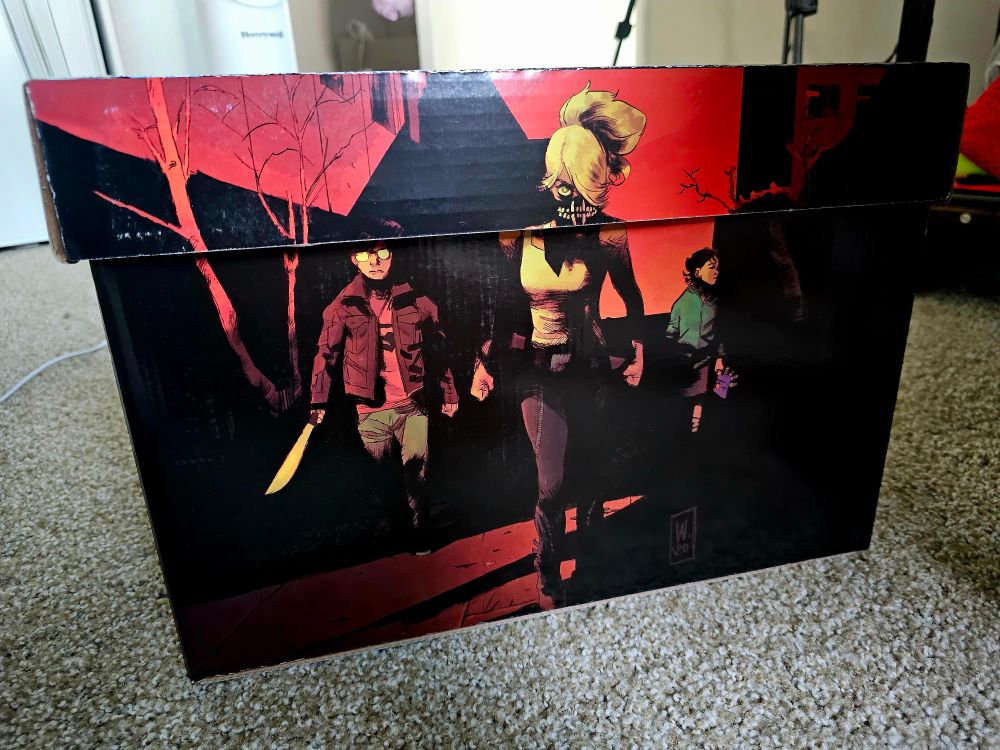 A side view of the same comic storage box decorated with art from the series Something is Killing the Children