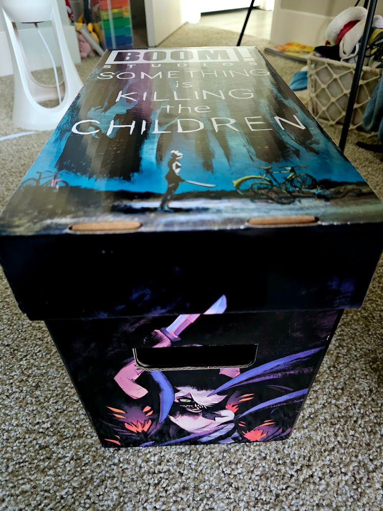 A comic storage box decorated with art from the series Something is Killing the Children