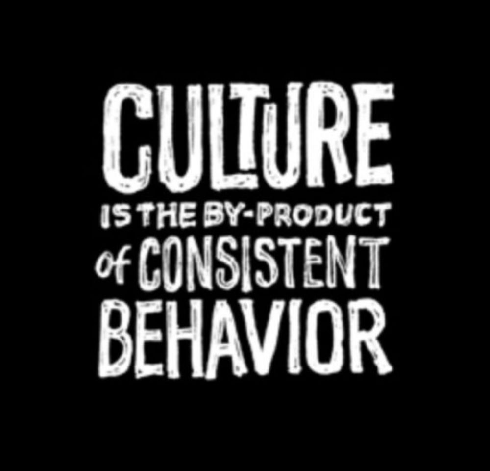 White text on a black background, stating "Culture is the byproduct of consistent behavior"