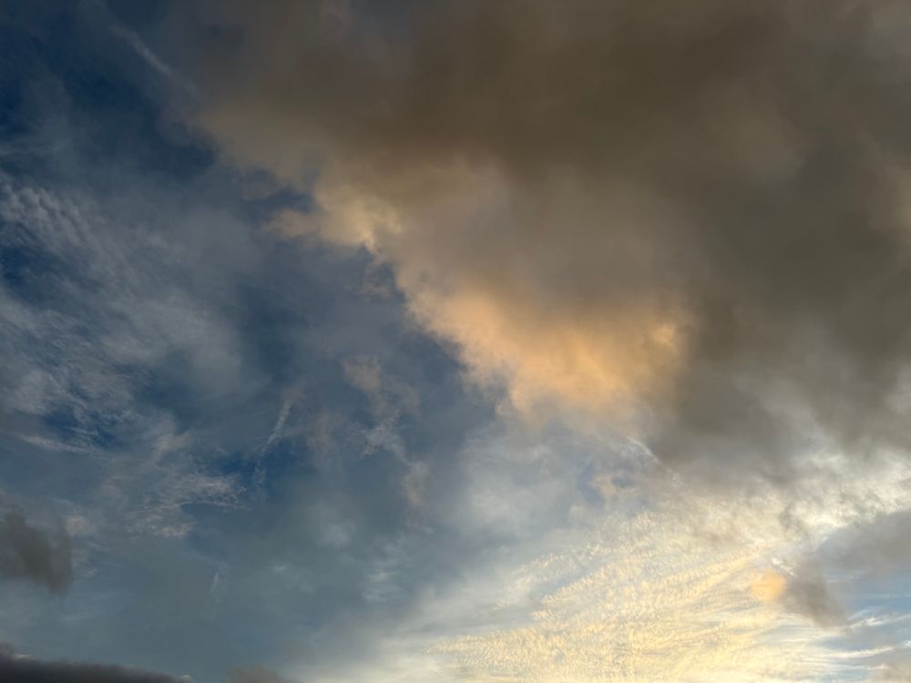 Four frames of a sunset sky in late September. Glow-tinged dreamy clouds against cerulean blue skies. Abstract sky-canvas art. Ever-changing, never the same.  