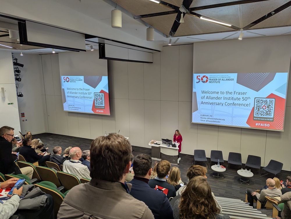 Mairi Spowage doing her welcome address at the FAI 50th anniversary conference in front of a large audience