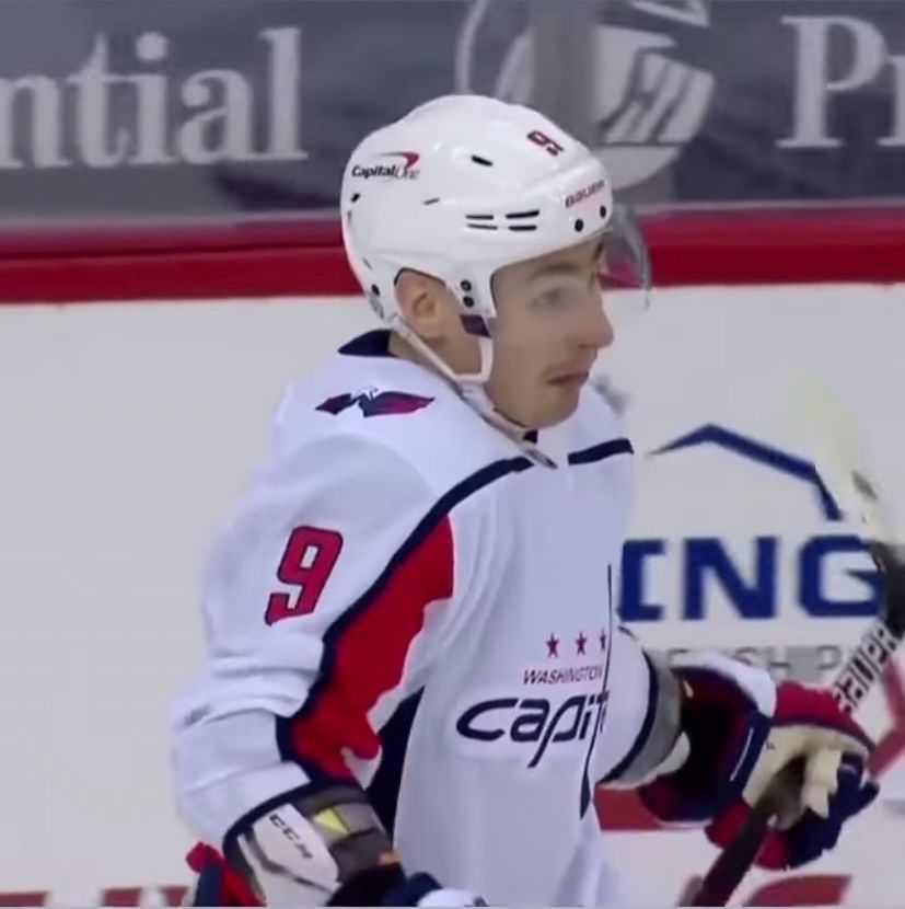 Dimitry Orlov shrugs exaggeratedly into the caps white jersey