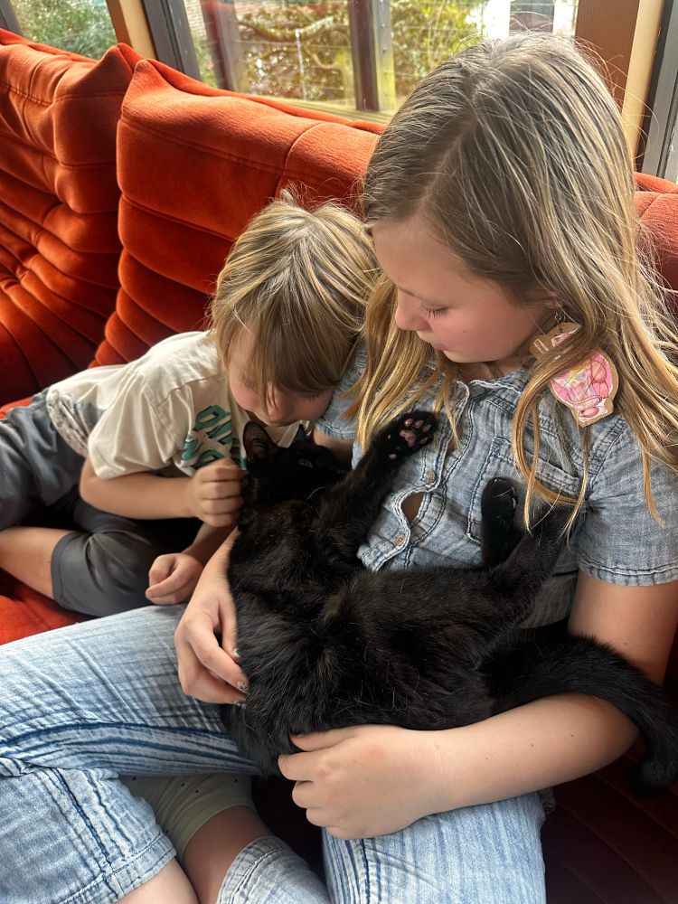 My two oldest kids snuggling with Olive on her last day. 