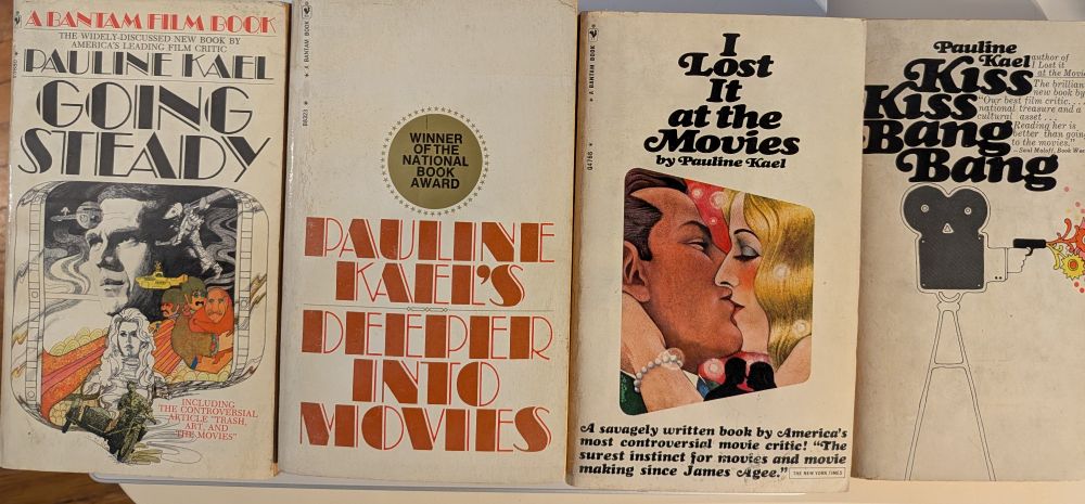 Four paperback books -- collections of movie  reviews by Pauline Kael: 'Going Steady', 'Deeper Into Movies', 'I Lost It at the Movies', and 'Kiss Kiss Bang Bang.'