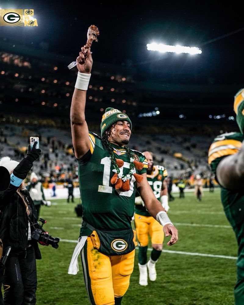 Jordan Love holds up a turkey leg after winning a game on Thanksgiving 
