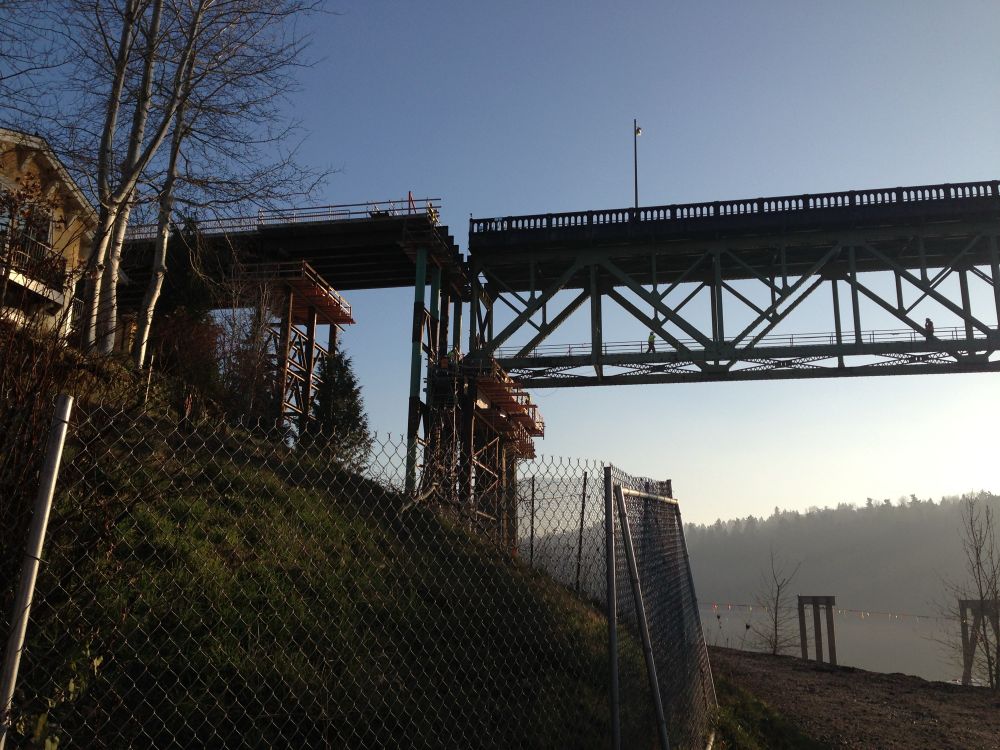Photo of the center span of the old Sellwood bridge being pushed over on to temporary supports (2013)