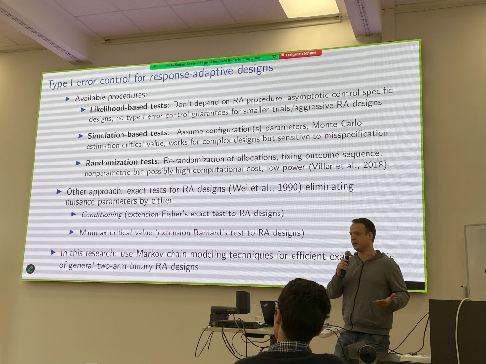 Photo of Stef Baas giving talk, with presentation screen behind him. 