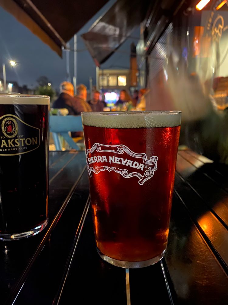 A glowing copper pint of Sierra Nevada Celebration joined by some Theakstons Old Peculier to its left hand side. 