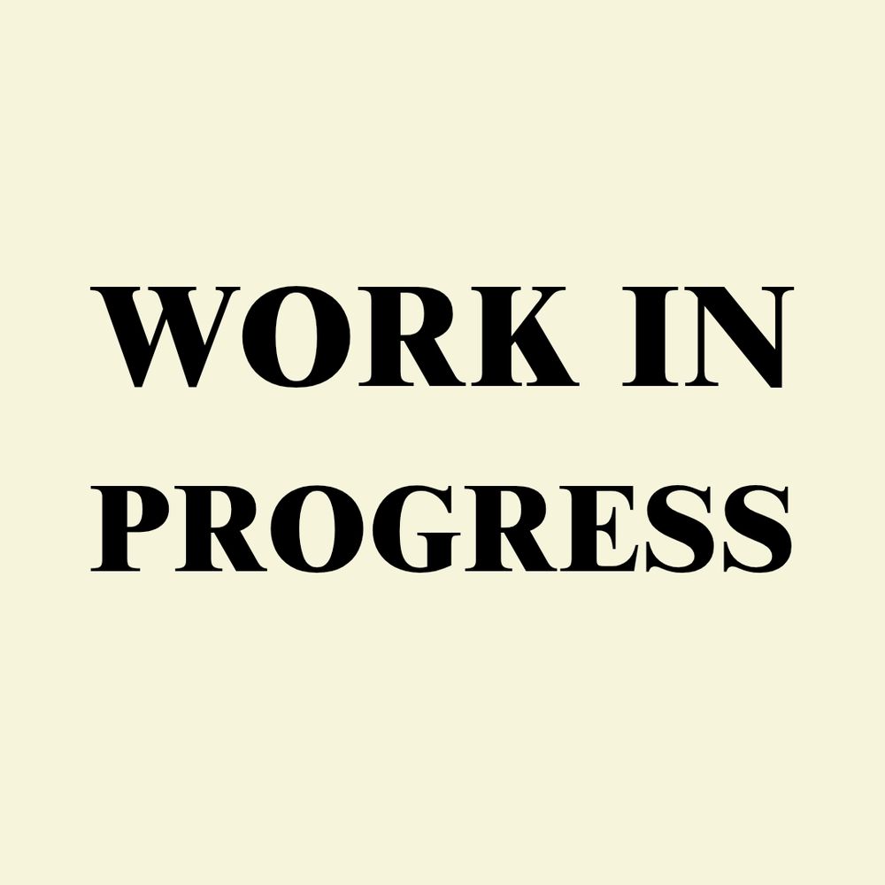 black text on an off-white background reading "work in progress"
