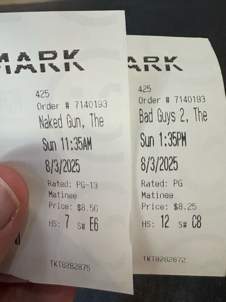 Theater tickets for The Naked Gun and The Bad Guys 2, held side by side.