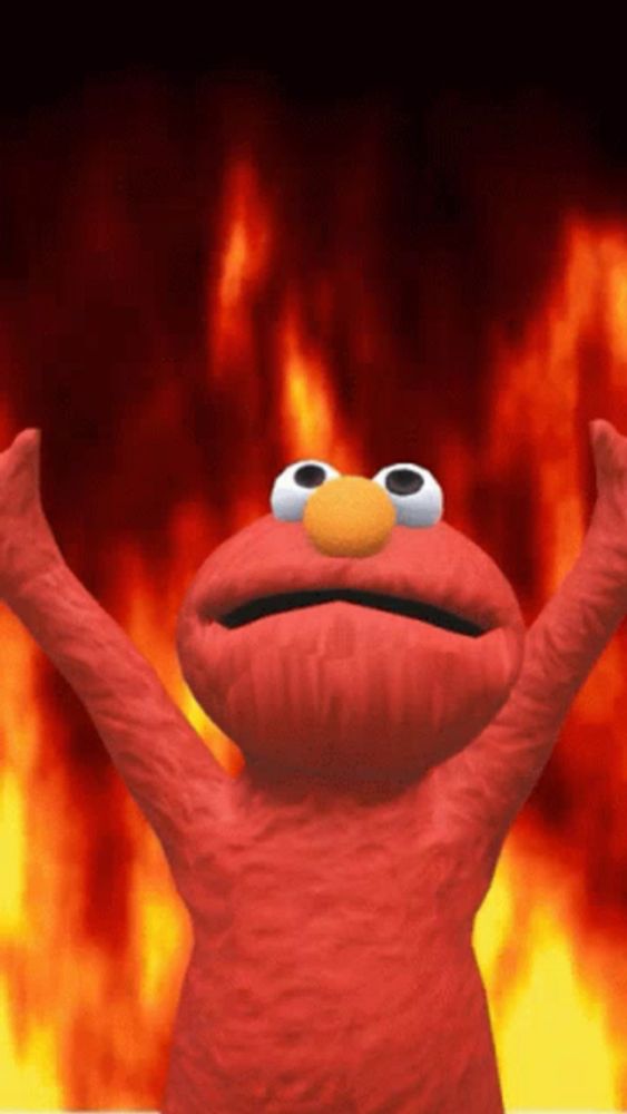 elmo from sesame street is standing in front of a fire background