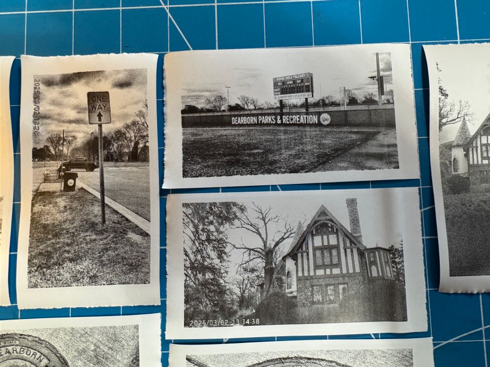 Thermal prints of a Tudor style house, one way sign, and a baseball score board
