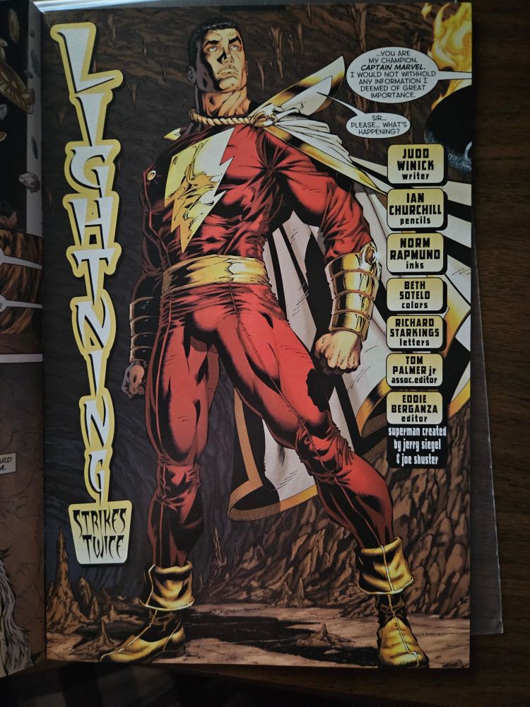 Interior page of Action Comics 826 featuring guest star Captain Marvel standing heroically while speaking to the wizard Shazam off page. Written by Judd Winnick. Art by Ian Churchill & Norm Rapmund.