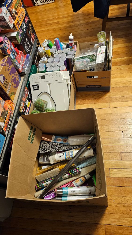 Various craft supplies in boxes