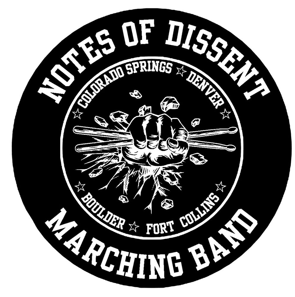 Circular logo with Notes of dissent written around the outer edge. An inner white circle is lined with the locations of the band, Denver, Colorado Springs, Boulder, and Fort Collins. The middle of the logo has a fist punching through a wall grasping drum sticks
