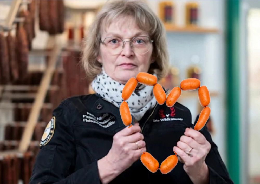Die Fleischwurstfrau mit einem Fleischwürstchen-Herz