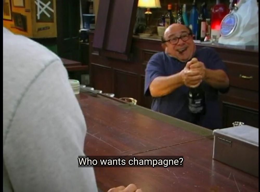 IASP: Frank celebrates the death of his ex-wife by smoking a cigar and popping a bottle of champagne behind the bar. 