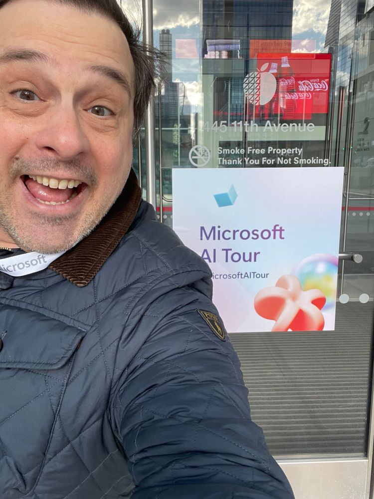 Standing in front of the Microsoft AI Tour sign outside the Javits Center North in New York City