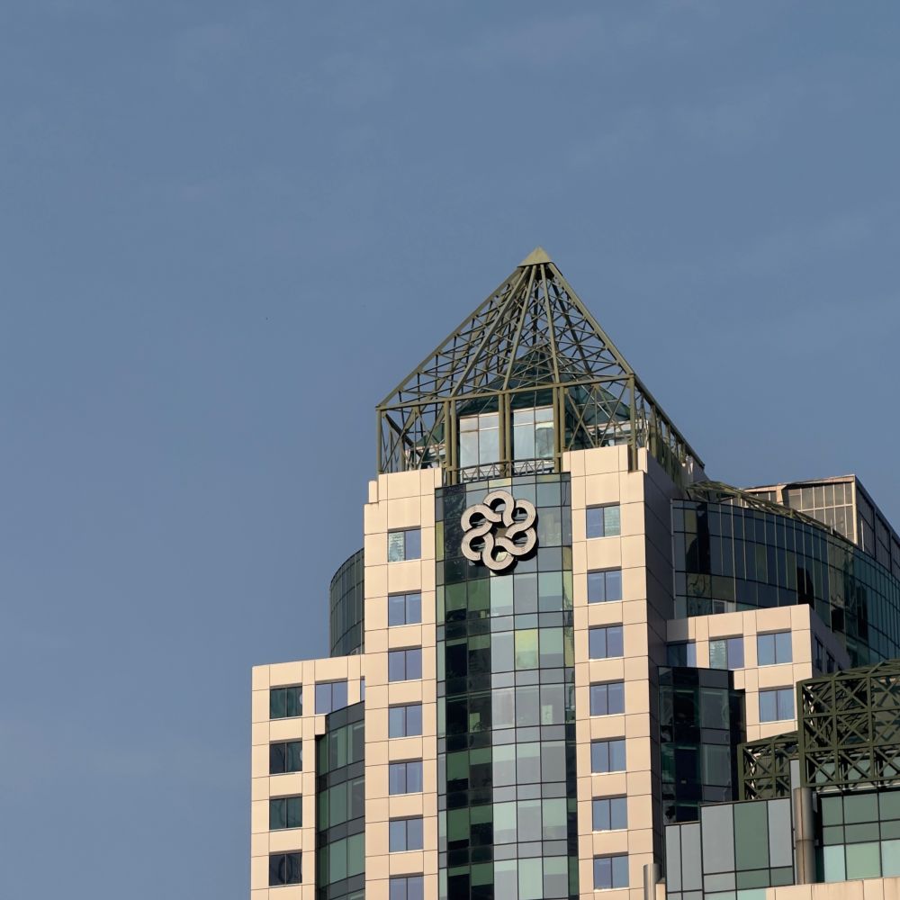 Photo of Metro Hall in Toronto, with old Metropolitan Toronto logo on the face of the building.