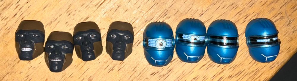 Eight faceplate:

Mr. Terrific, Teath Gritted
Mr. Terrific, Slight Smile
Mr. Terrific, Serious Mouth
Mr. Terrific, Essentially Identical Serious Mouth
Robot #4, Eye All The Way Open
Robot #4: Eye Mostly Open
Robot #4: Eye Mostly Czlosed
Robot #4: Eye All The Way Closed