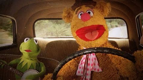 Kermit and Fozzie Bear in the car.