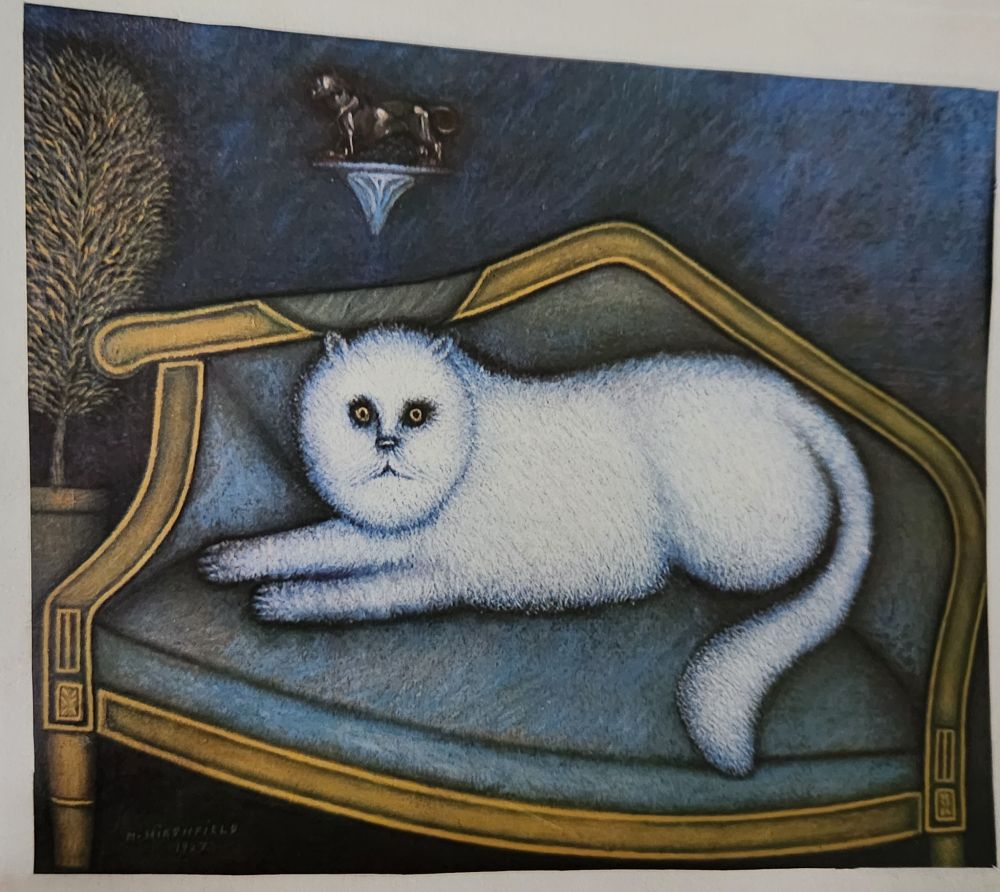 A print of a white cat??? Maybe a dog??? lounging on a blue sofa. This animal, whatever it is, looks like it has seen some shit, or was possibly a naughty boy transformed in to a baby monster by a witch. For some reason, my husband brought this cursed picture into our home. Please ask to see it when you come visit.