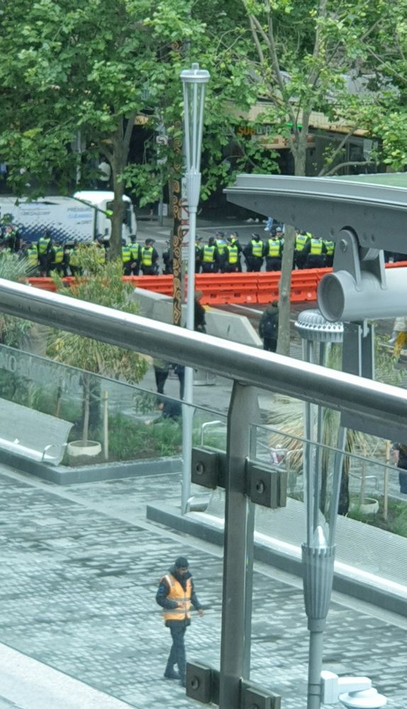 Massive police presence and barricades on Melbourne City Square 