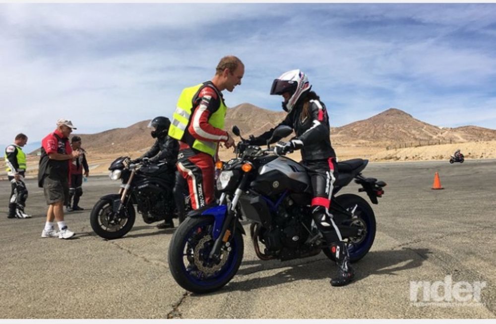 Motorcyclists getting pointers from instructors at Willow Springs Raceway