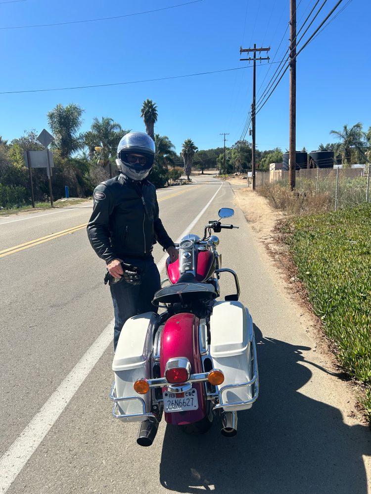 Electra Glide Highway King pulled over with my S.O. standing beside it. 