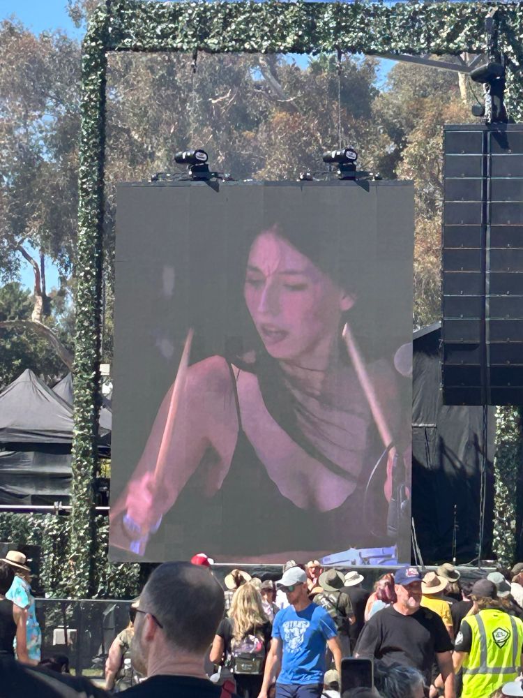 The drummer of Lambrini Girls playing during their set at Ohana Fest ‘25 while performing Cuntology 101