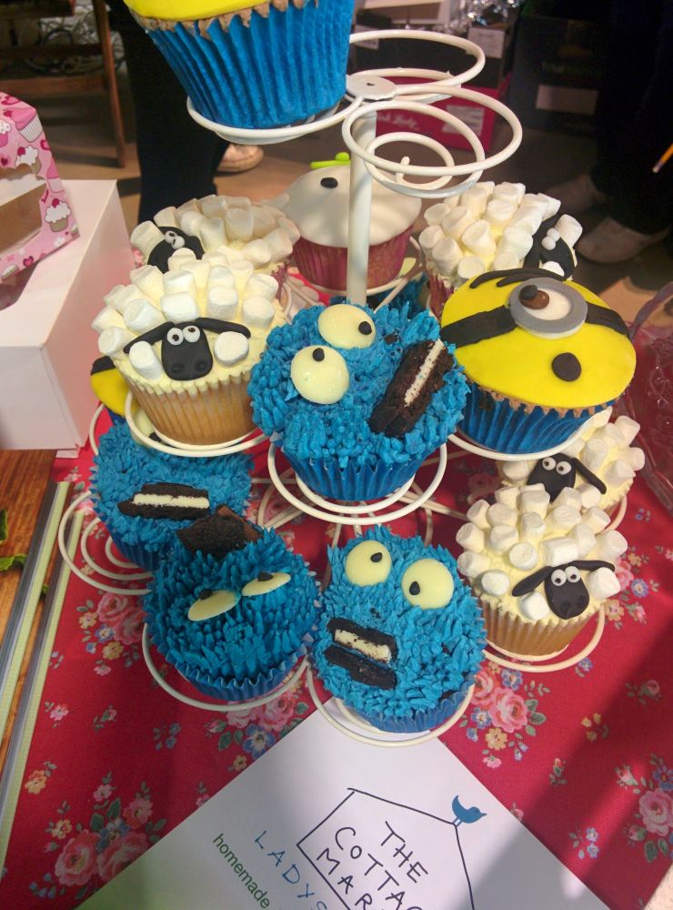 Cupcakes that look like Cookie Monster and Shaun the Sheep. 