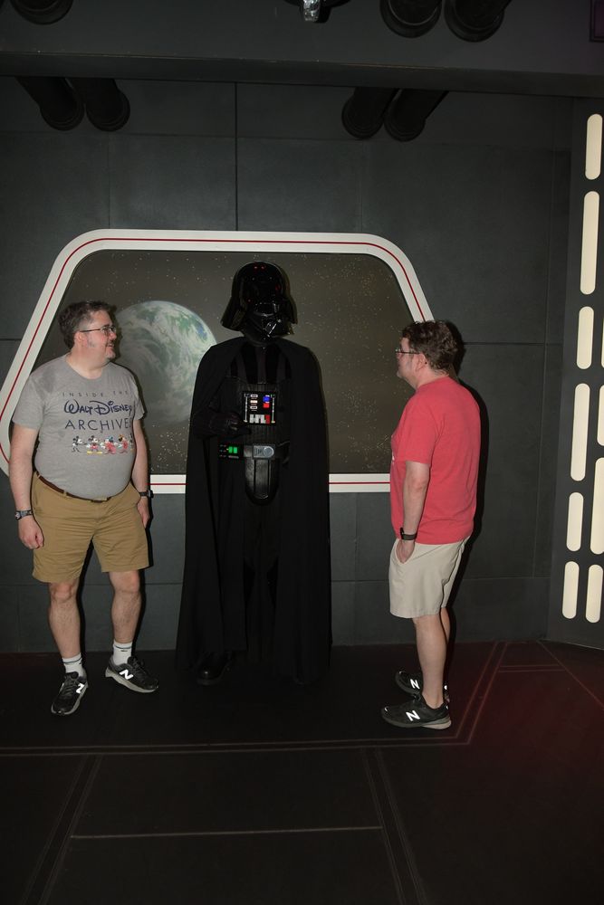 One gentleman has a conversation with Lord Vader while a very sweaty gentleman on the left looks on.  The sweat marks are from wearing my backpack all day.  