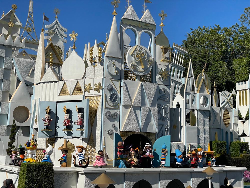 The facade of Its a Small World at Disneyland.  It was quarter til the hour, and we caught the clock tower parade.  