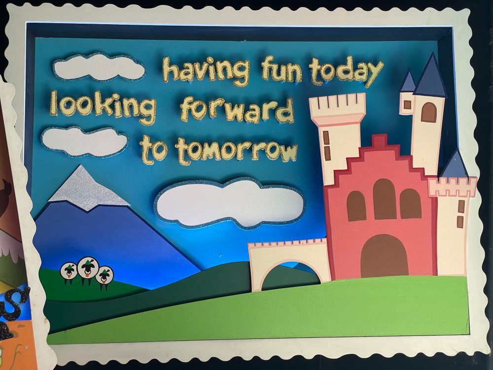 A postcard from inside Its a Small World.  Reading “having fun today looking forward to tomorrow”.  