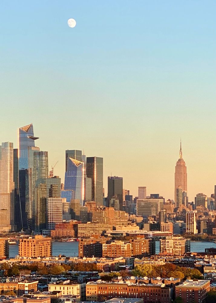 Moon rising over midtown Manhattan as sunset approaches. 