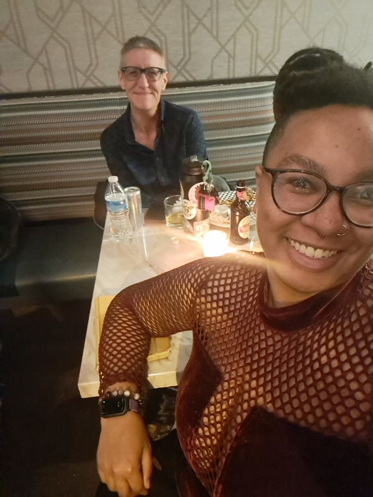 Two friends take a selfie. 