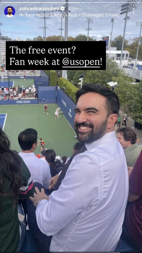Screenshot of Zohran’s IG story. He is smiling back at the camera with a tennis match in the background. The caption of the post reads: The free event? Fan week at @usopen!
