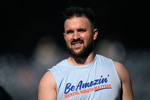 Luis Torrens in a Mets themed shirt that reads “Be Amazin’: Mental Health Matters”