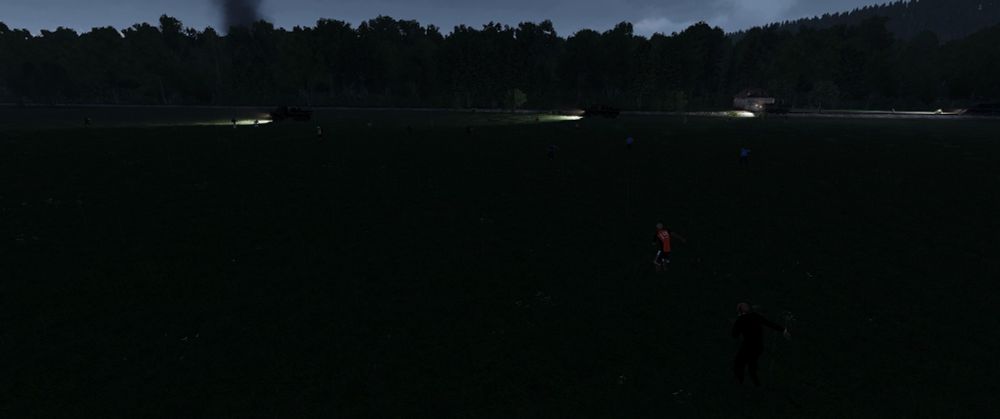 The platoon in stolen trucks pushing through an open field in the darkness with zombies closing in